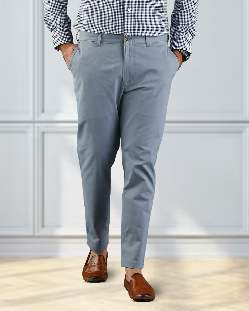 Model wearing custom Genoa Chino pants for men by Luxire in soft blue grey